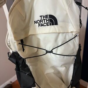 The North Face Cream and Black Backpack